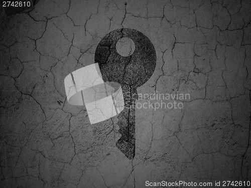 Image of Security concept: Key on grunge wall background