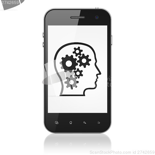 Image of Business concept: Head With Gears on smartphone