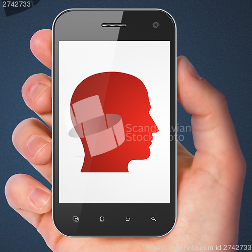 Image of Information concept: Head on smartphone