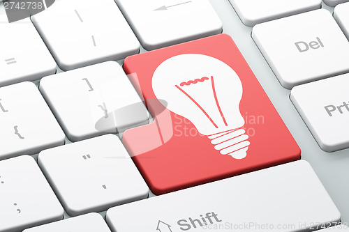 Image of Business concept: Light Bulb on computer keyboard background