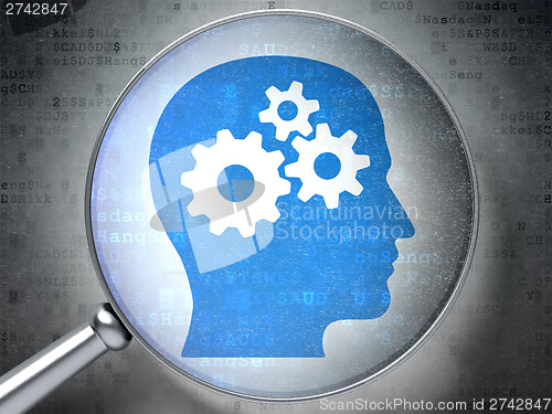 Image of Finance concept:  Head With Gears with optical glass on digital