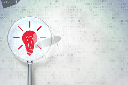 Image of Finance concept:  Light Bulb with optical glass on digital backg