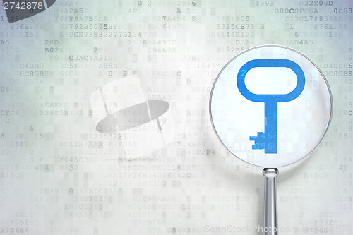 Image of Protection concept:  Key with optical glass on digital backgroun