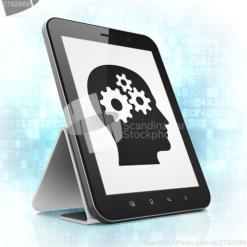 Image of Advertising concept: Head With Gears on tablet pc computer