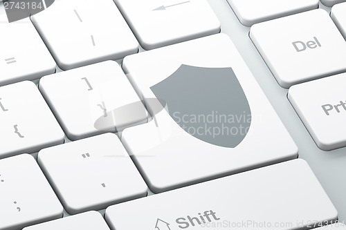 Image of Security concept: Shield on computer keyboard background