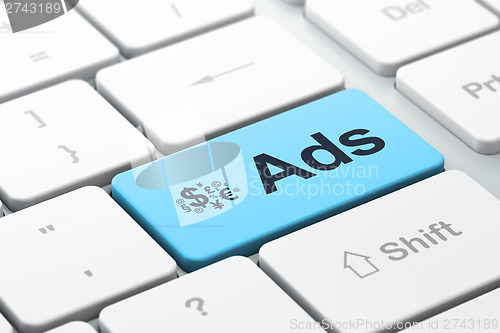 Image of Advertising concept: Finance Symbol and Ads on computer keyboard