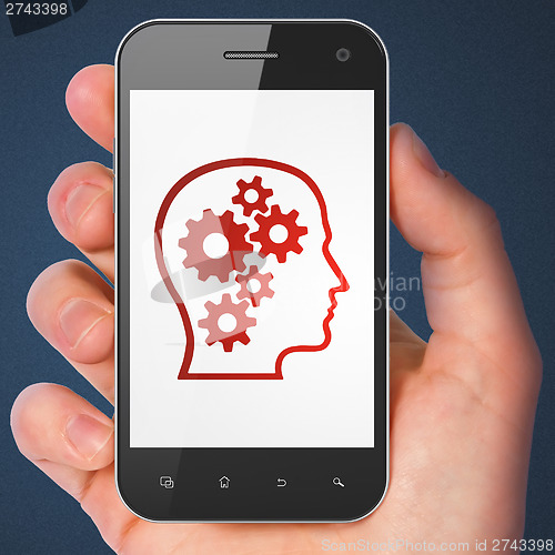 Image of Data concept: Head With Gears on smartphone