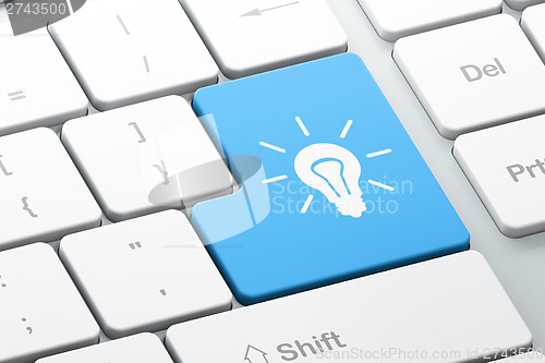 Image of Finance concept: Light Bulb on computer keyboard background