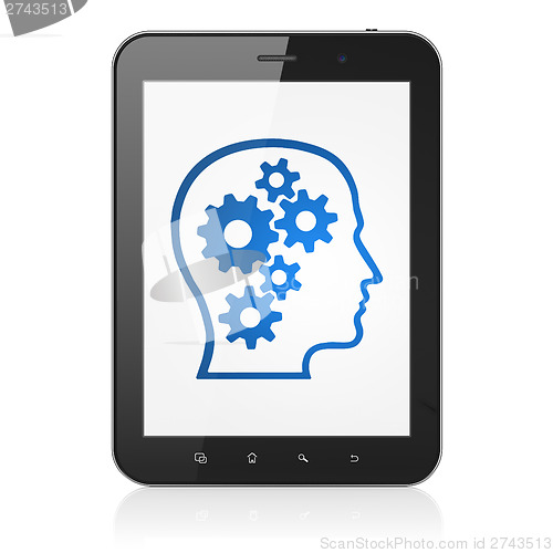 Image of Information concept: Head With Gears on tablet pc computer