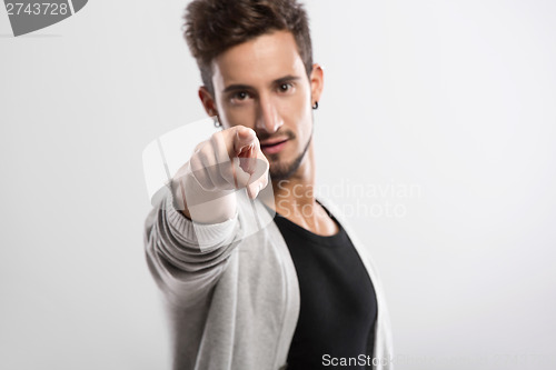 Image of Young man pointing