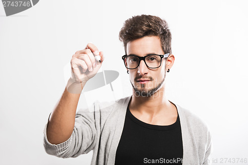 Image of Young man writing on a glass