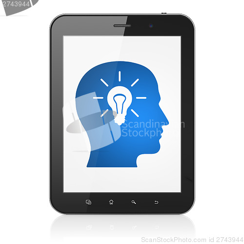 Image of Education concept: Head With Light Bulb on tablet pc computer