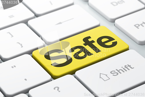 Image of Security concept: Safe on computer keyboard background