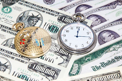 Image of Pocket watches and money