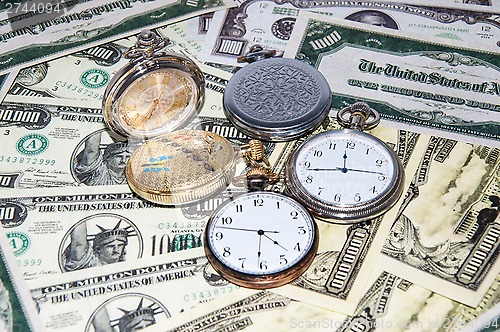 Image of Pocket watches and money