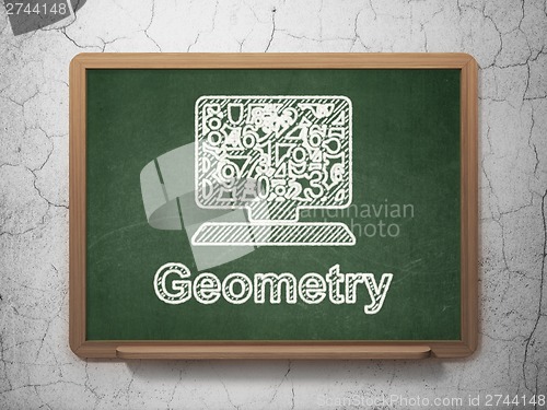 Image of Education concept: Computer Pc and Geometry on chalkboard background