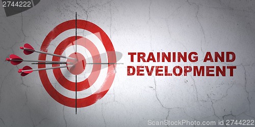 Image of Education concept: target and Training and Development on wall background