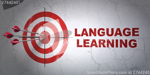 Image of Education concept: target and Language Learning on wall background
