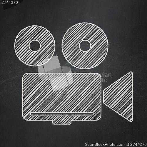 Image of Travel concept: Camera on chalkboard background