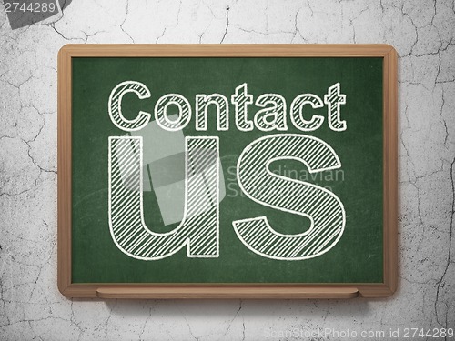 Image of Advertising concept: Contact Us on chalkboard background