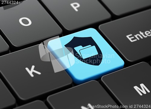Image of Business concept: Folder With Shield on computer keyboard background