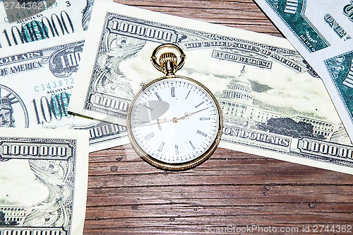 Image of Pocket watches and money.