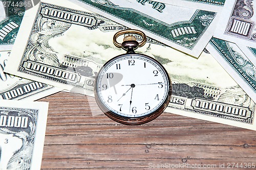 Image of Pocket watches and money.