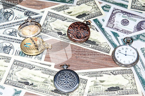 Image of Pocket watches and money.