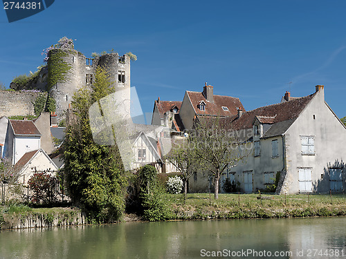 Image of Montresor village and castle seen from the Indrois river, France