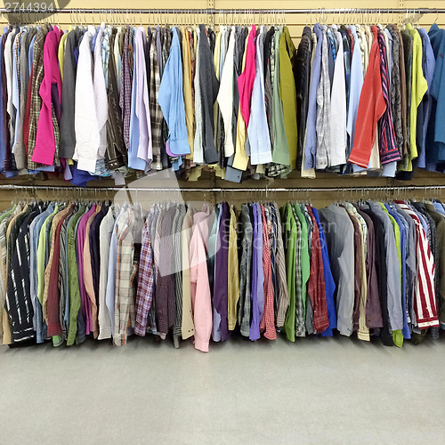 Image of Colorful clothes in a second hand store