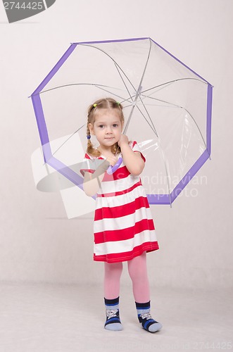 Image of Portrait of a three-year girl with an umbrella