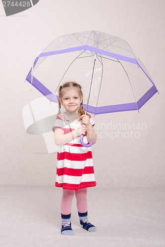 Image of Girl in dress with umbrella