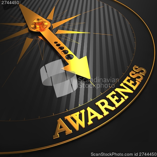 Image of Awareness Concept on Golden Compass.