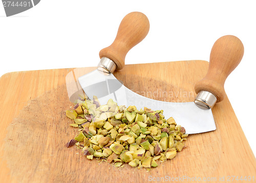 Image of Chopped pistachios with a rocking knife