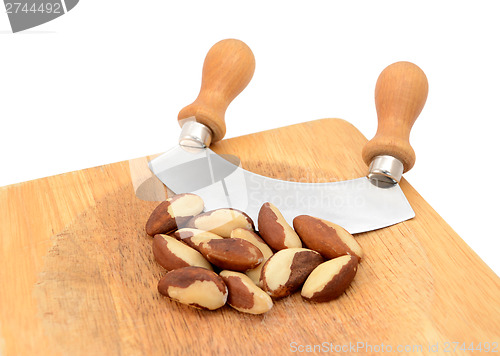 Image of Whole brazil nuts with a rocking knife