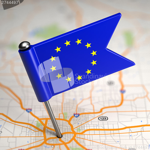 Image of European Union Small Flag on a Map Background.