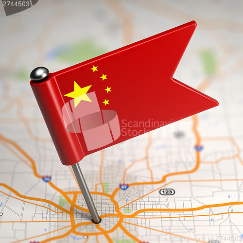 Image of China Small Flag on a Map Background.