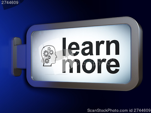 Image of Education concept: Learn More and Head With Gears on billboard b