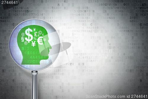 Image of Finance concept:  Head With Finance Symbol with optical glass on