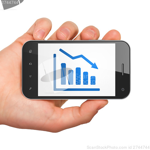 Image of Finance concept: Decline Graph on smartphone