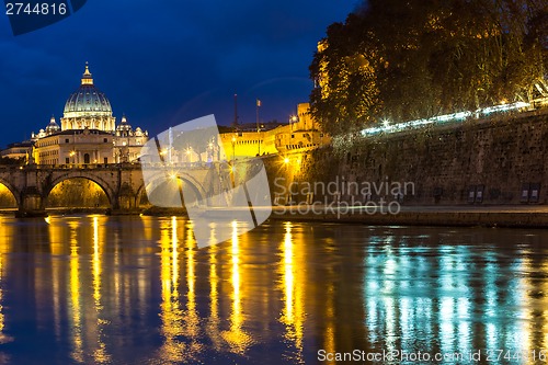 Image of Vatican and river Tiber in Rome - Italy at night .