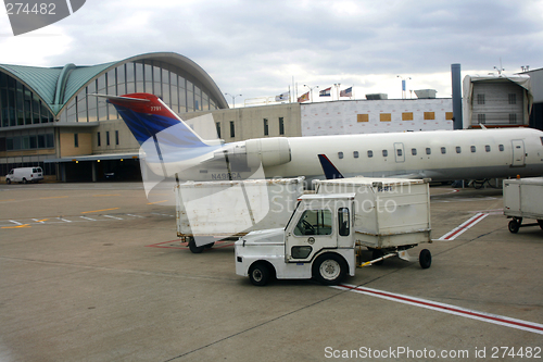 Image of Close up on a Plane and cargo car