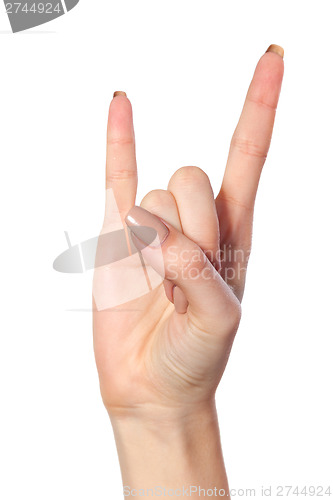 Image of A woman's hand giving the Rock and Roll sign