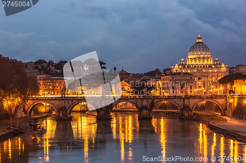 Image of Vatican and river Tiber in Rome - Italy at night .