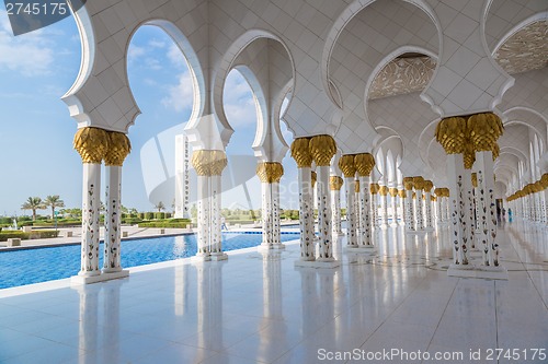 Image of Hallway with golden decorated pillars at the entrance of the wor