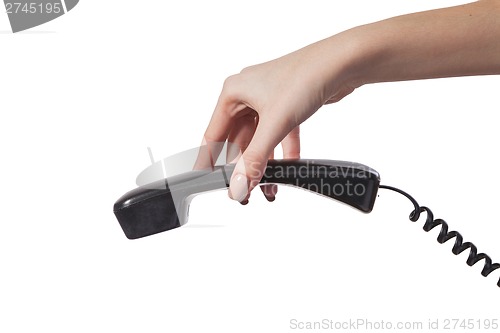 Image of Hand holding an old black telephone tube