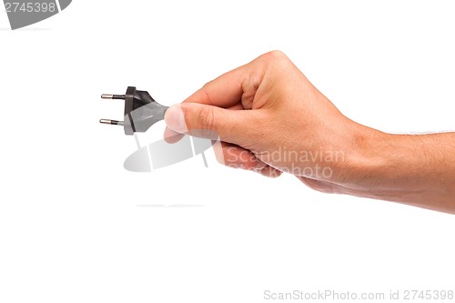 Image of Man is holding a black outlet in the hand