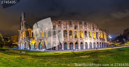 Image of Colosseum at night in Rome, Italy