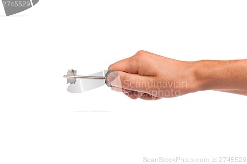 Image of Male hand holding a key to the house