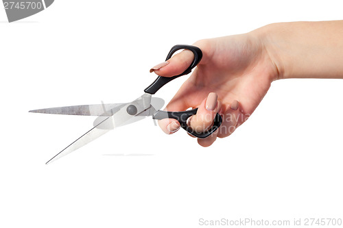 Image of Hand is holding scissors isolated